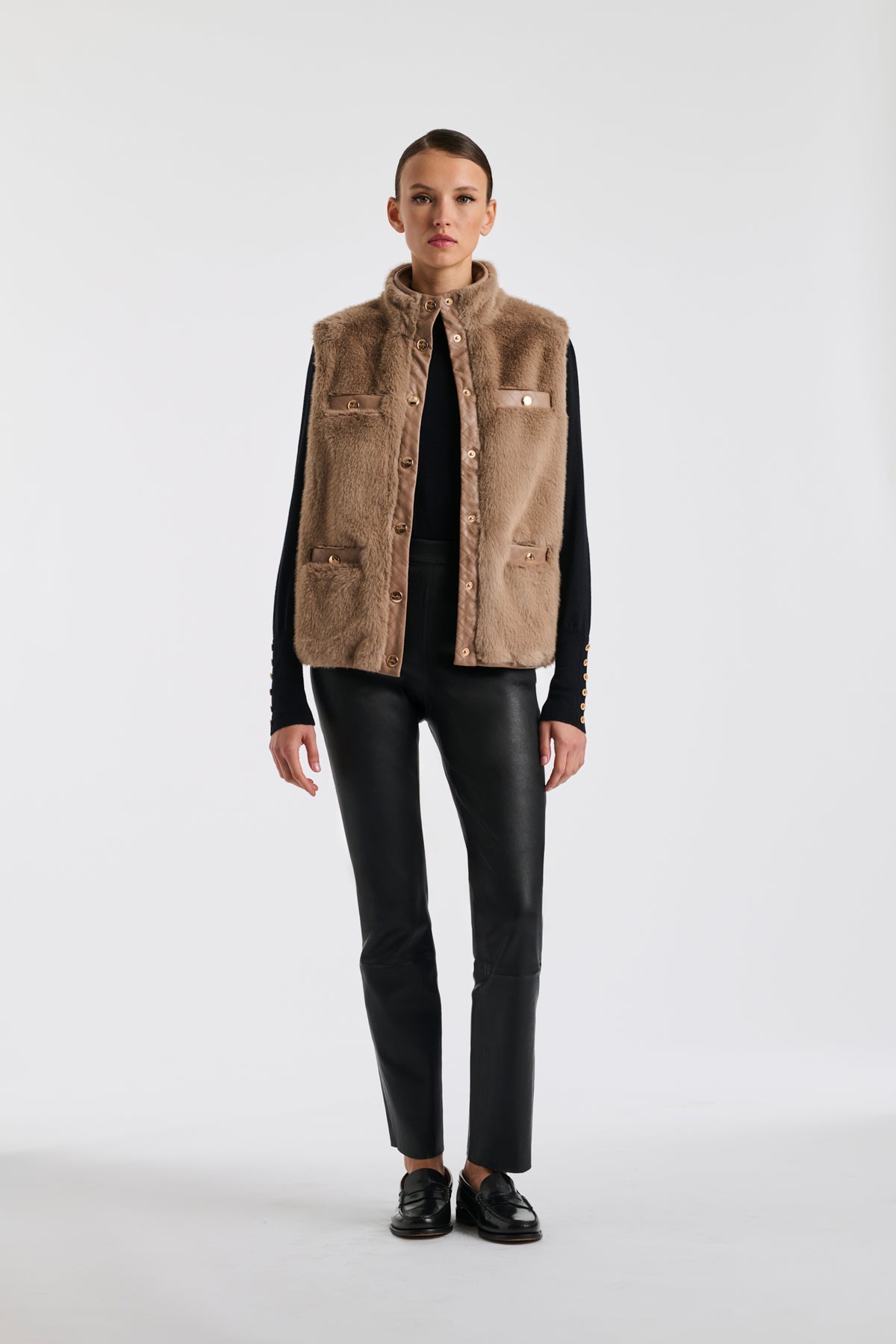 Bi-material sleeveless jacket