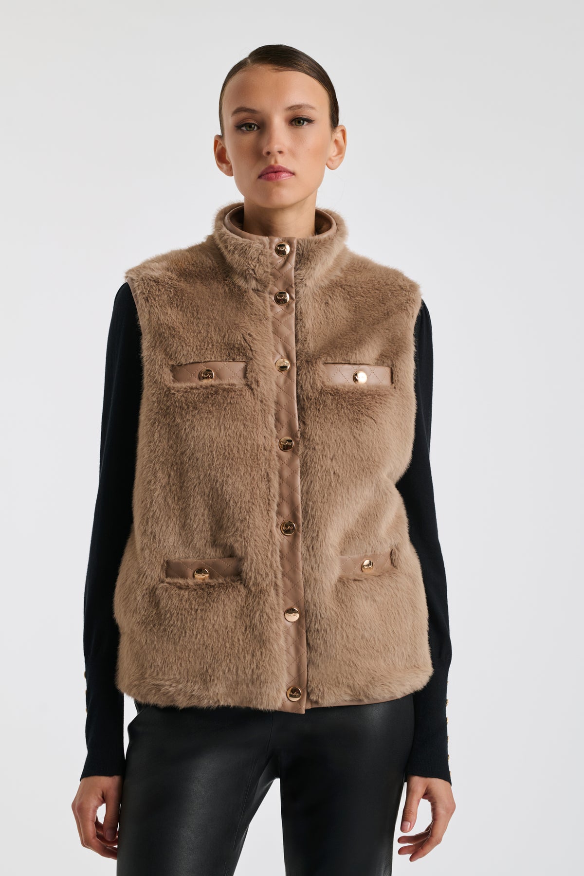 Bi-material sleeveless jacket