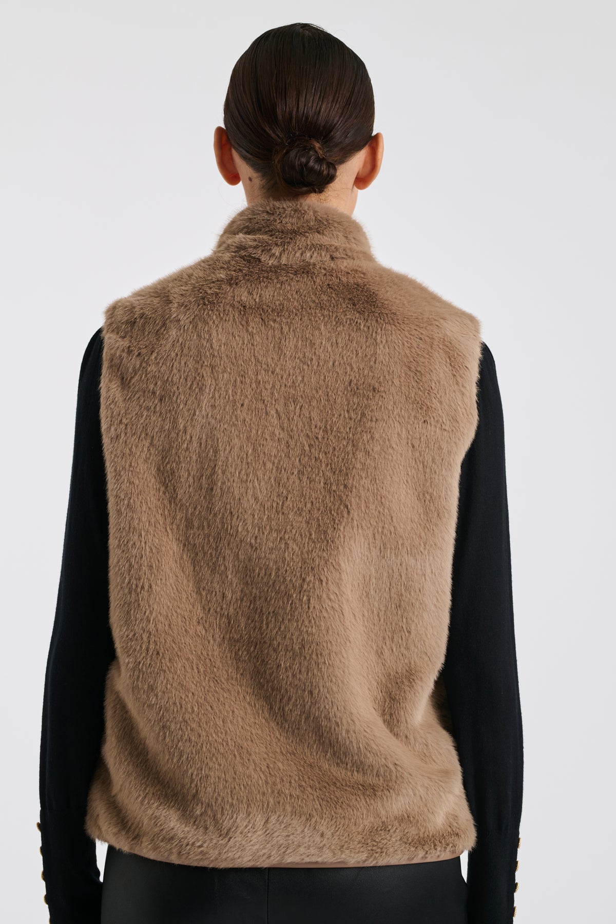 Bi-material sleeveless jacket