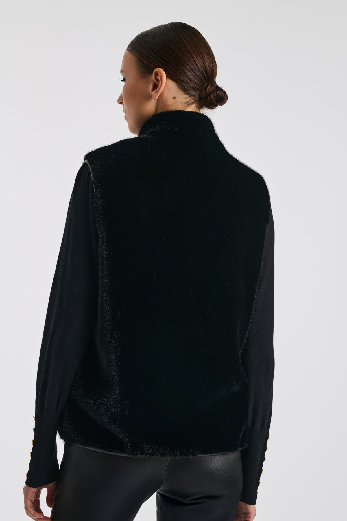 Bi-material sleeveless jacket