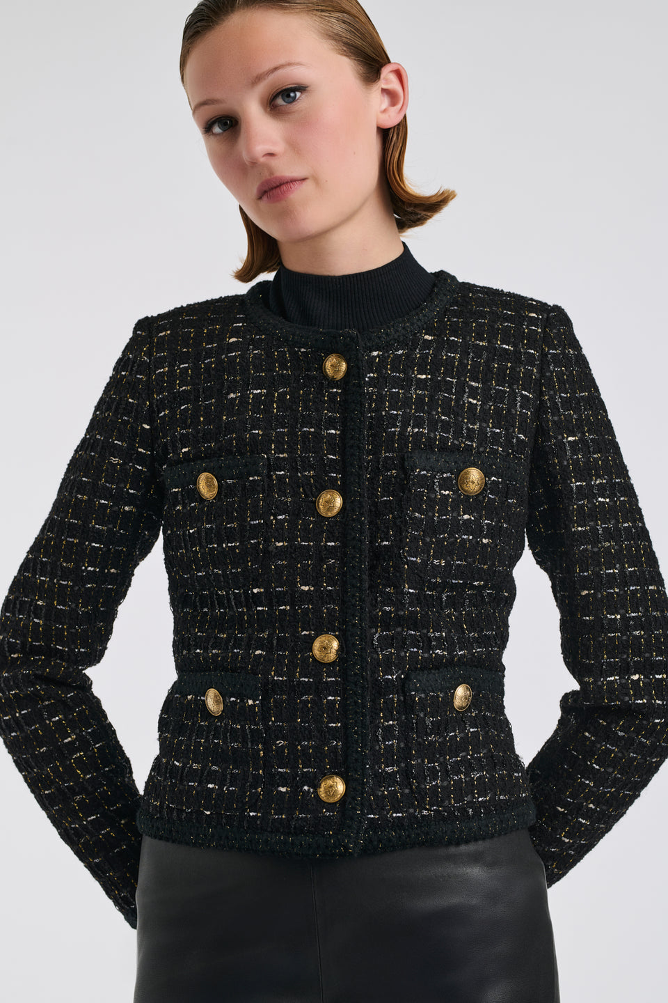 Veste en tweed noire et or