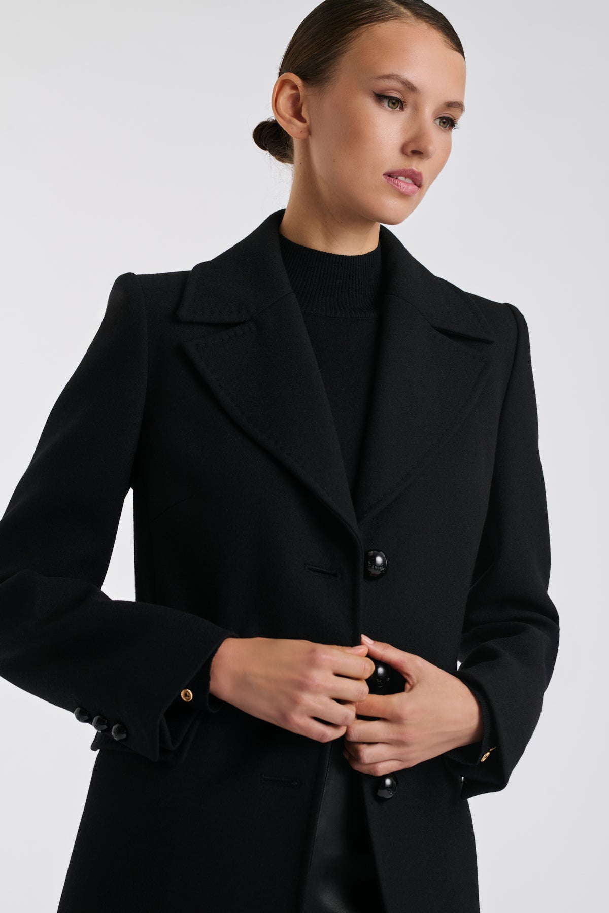 Black top-stitched wool overcoat