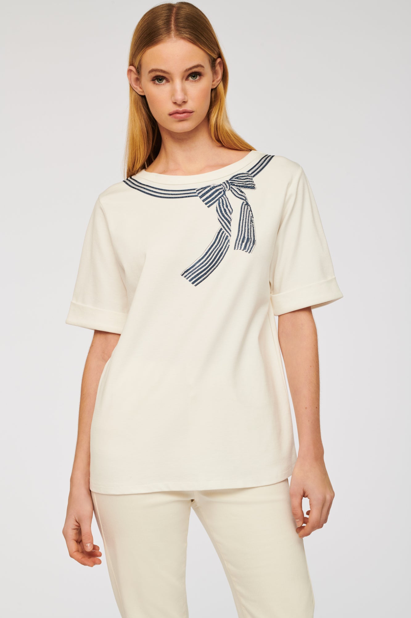 T-shirt with rhinestone bow and studs