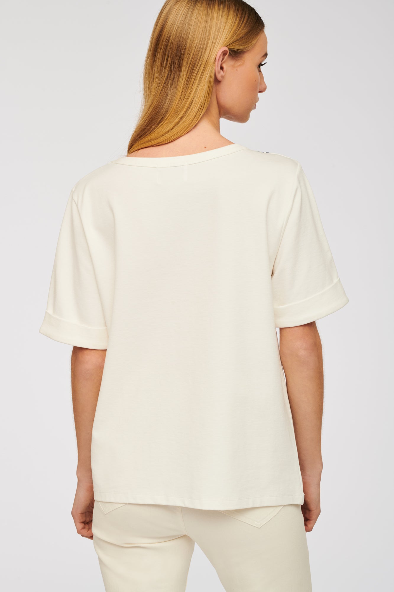 T-shirt with rhinestone bow and studs