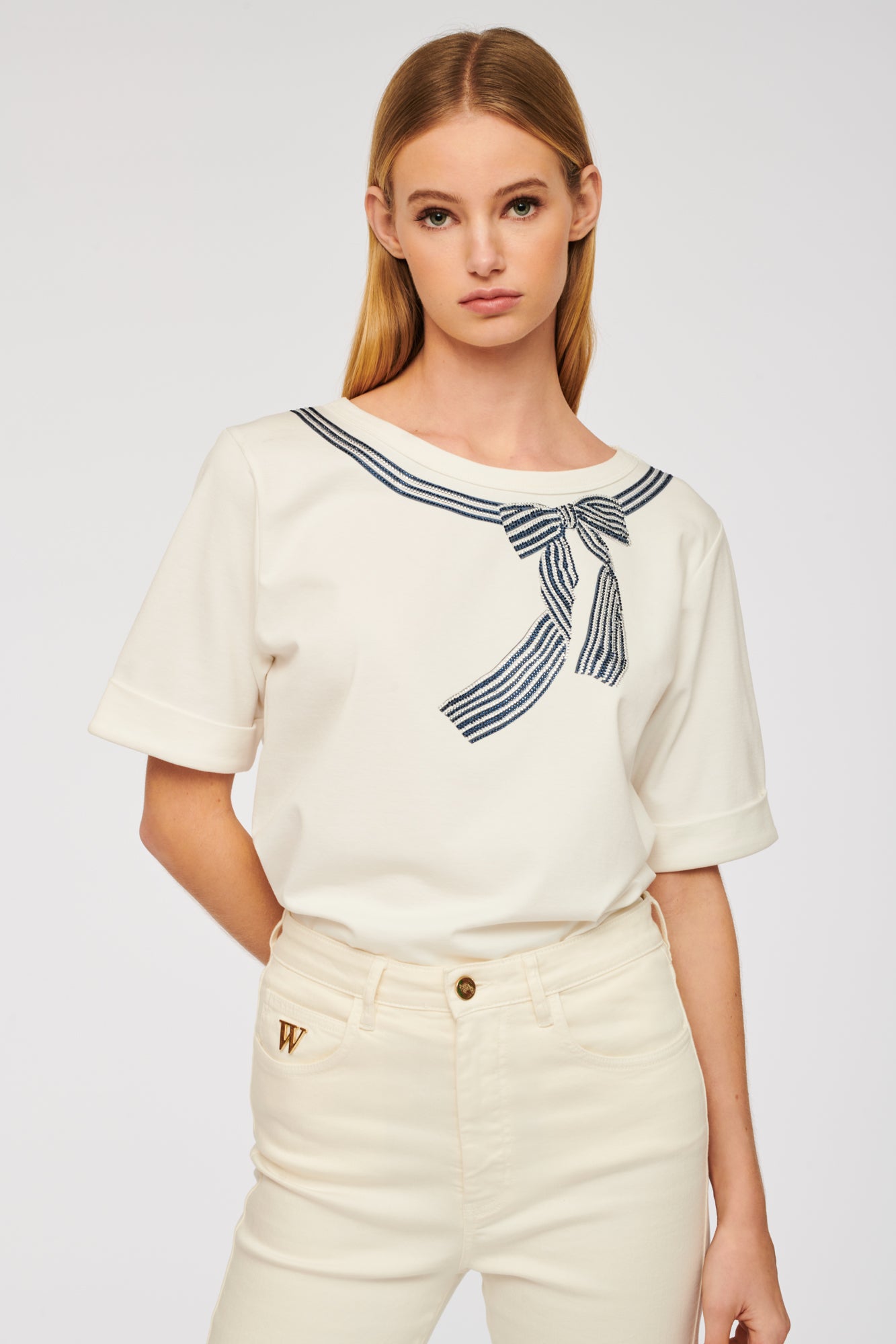T-shirt with rhinestone bow and studs
