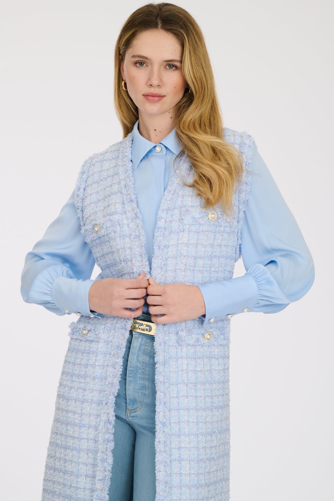 Long sleeveless jacket in fringed tweed