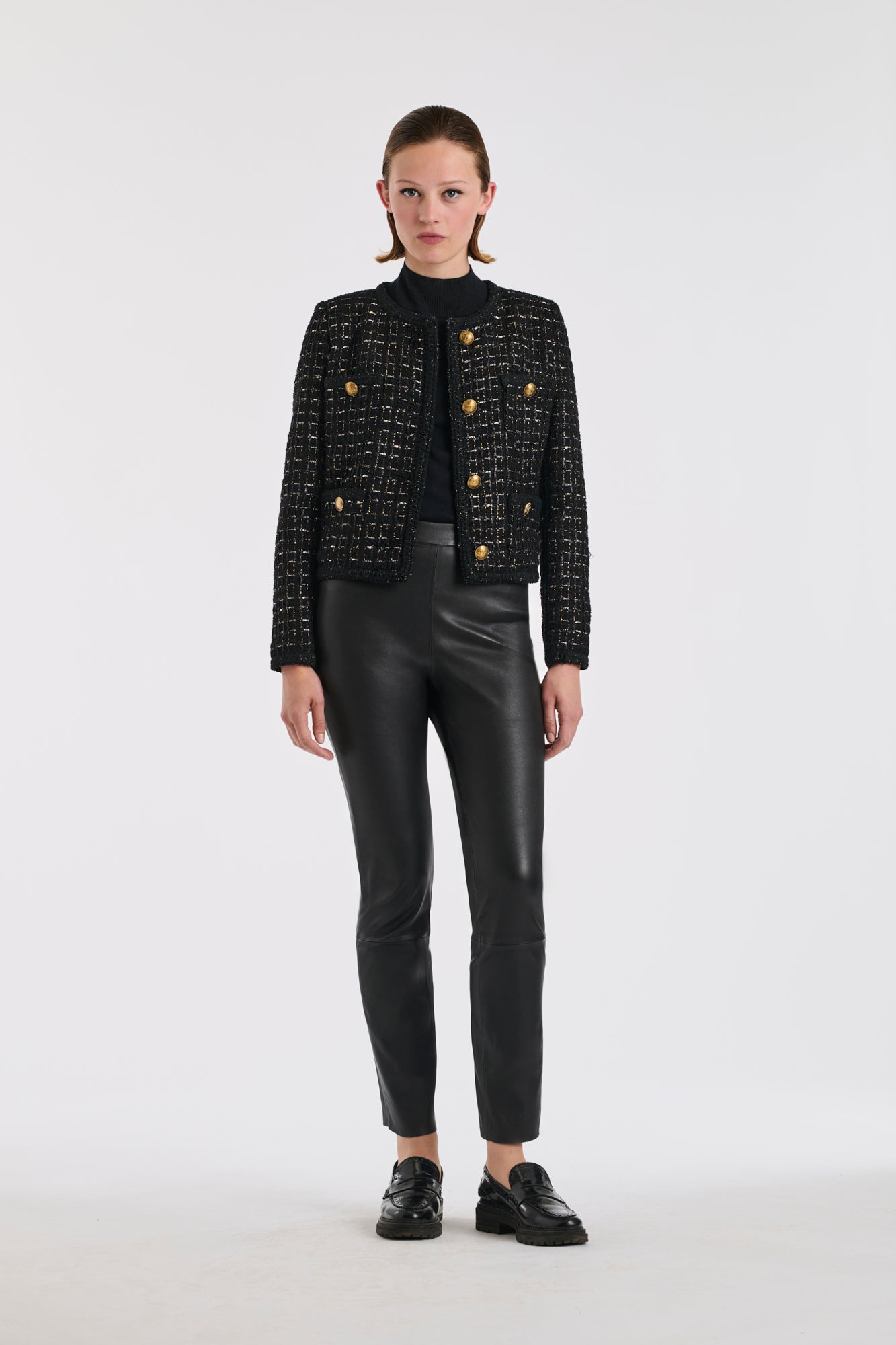 Veste en tweed noire et or