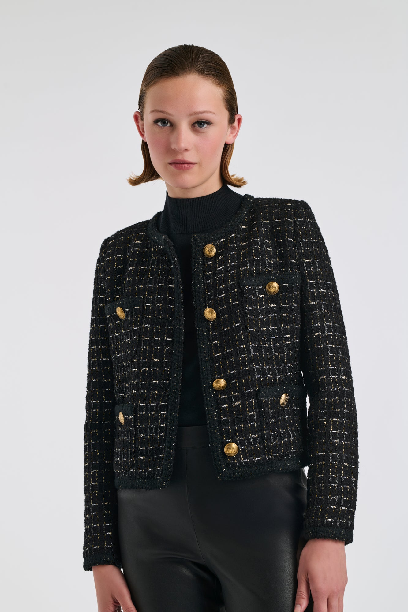 Veste en tweed noire et or