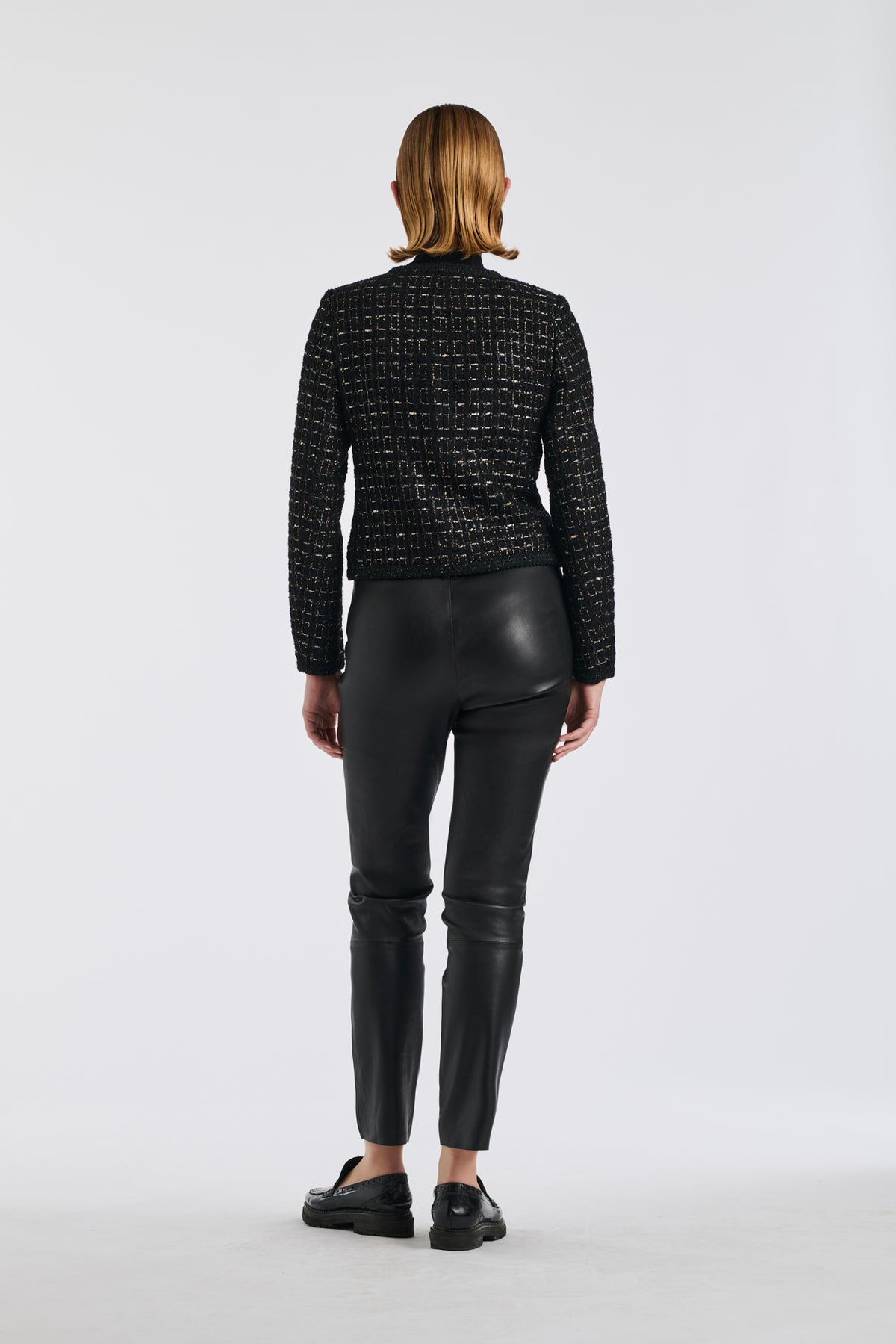 Veste en tweed noire et or