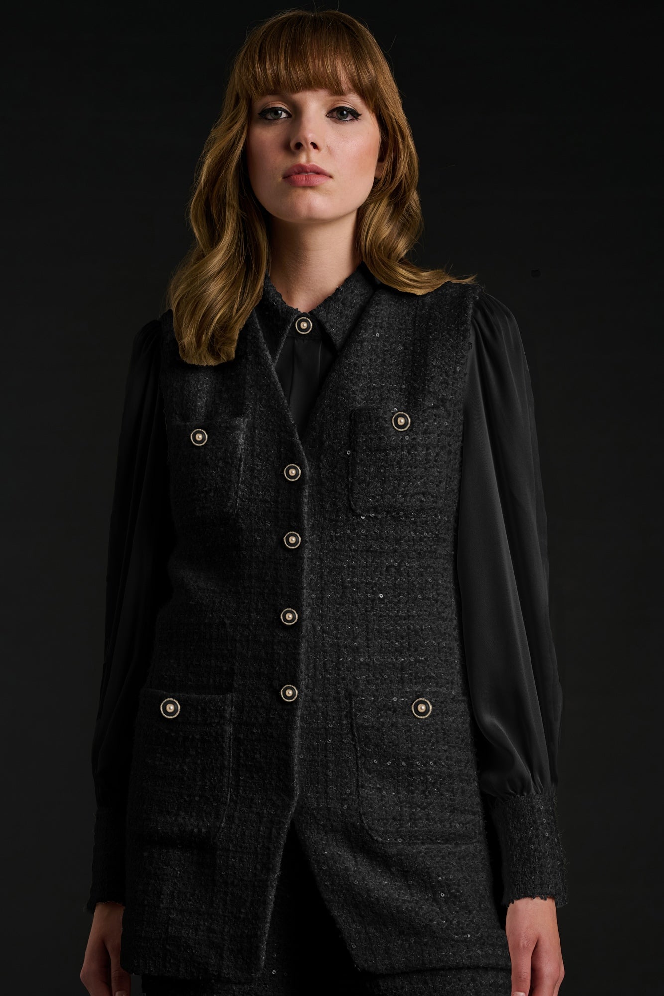 Sleeveless tweed jacket