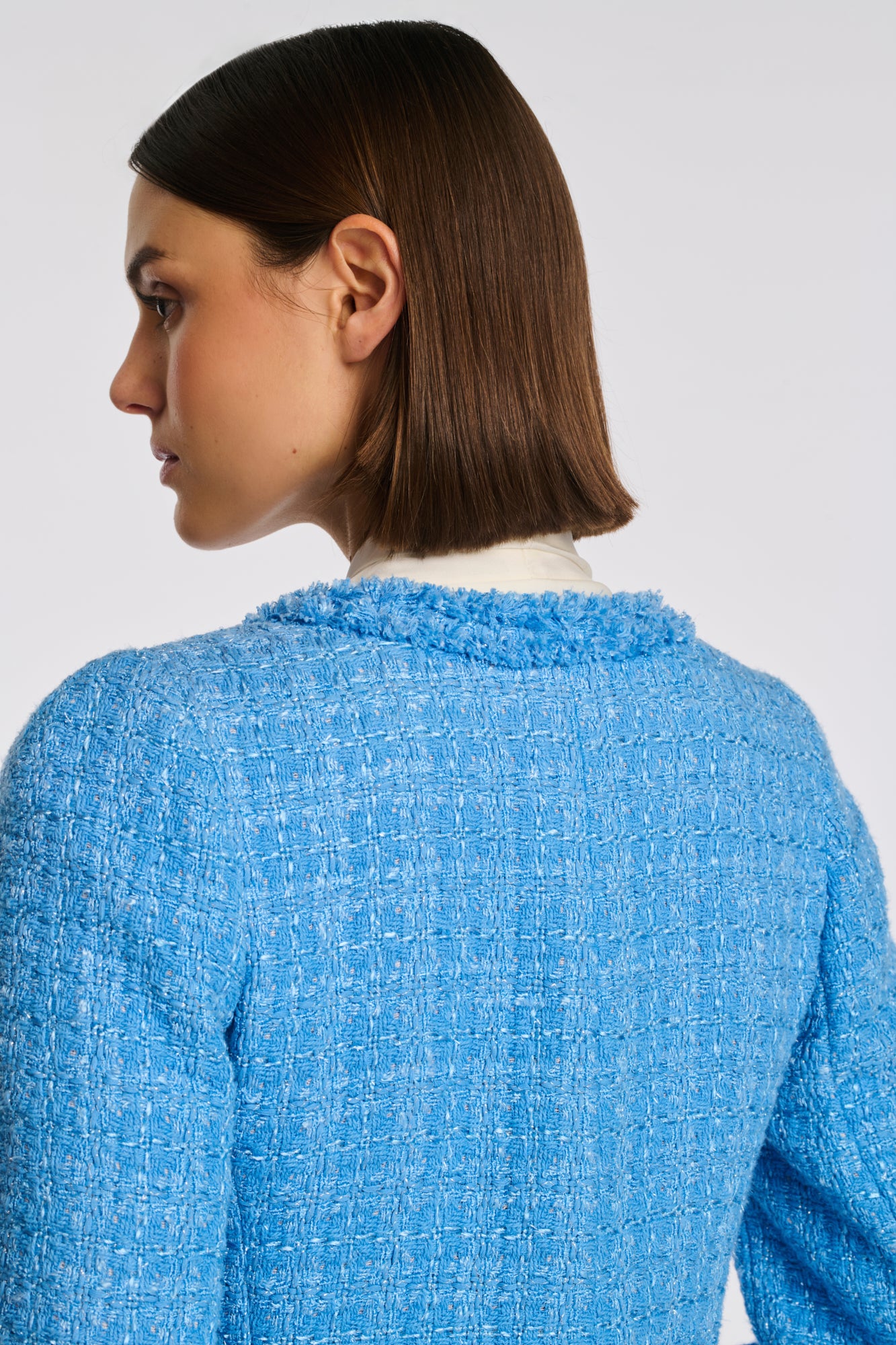 Manteau en tweed frangé