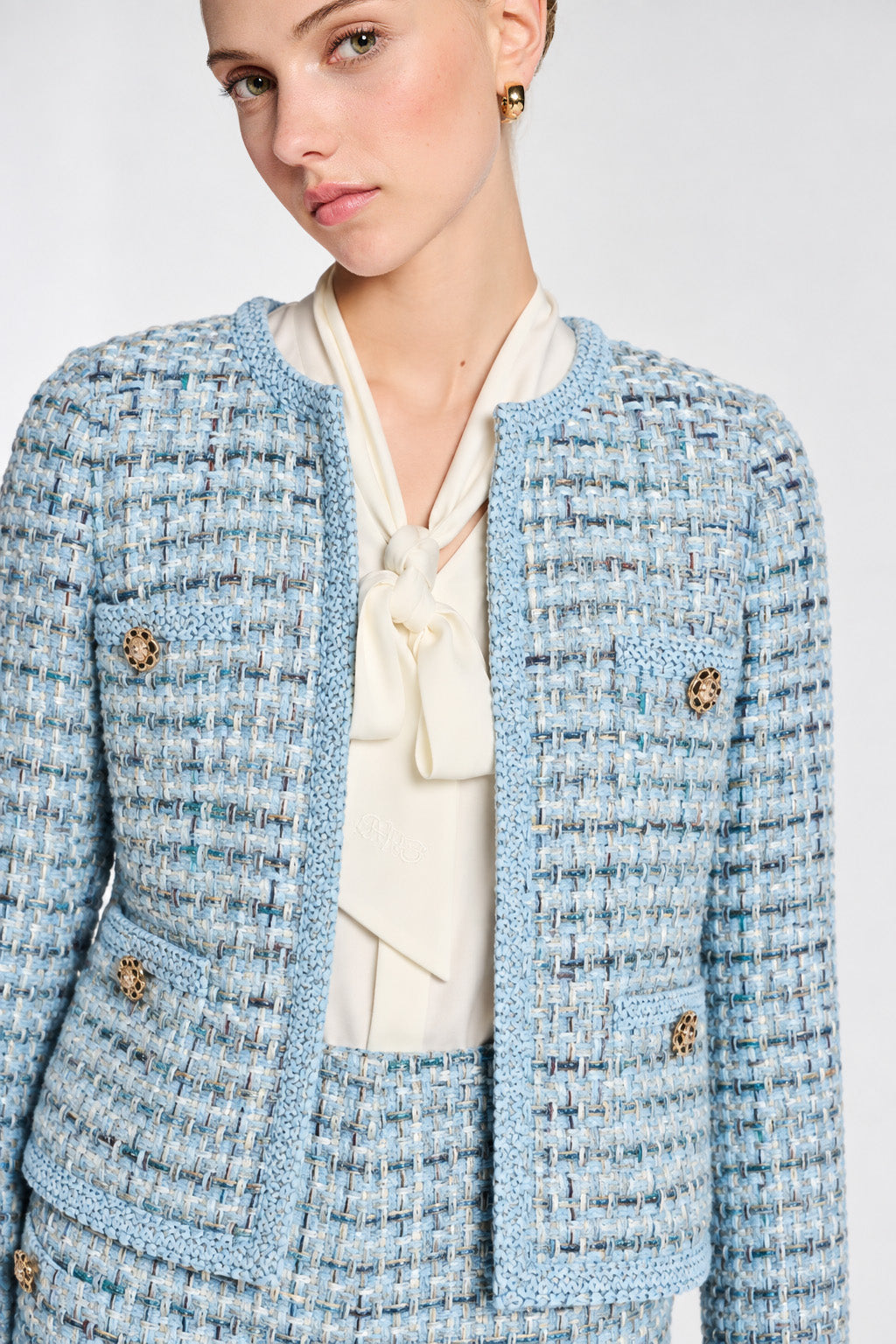Veste en tweed pastel galonnée