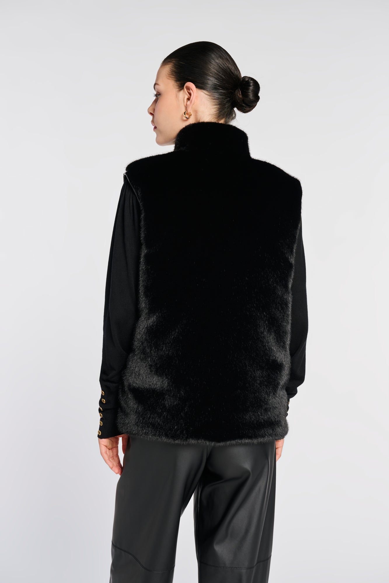 Sleeveless dual-material jacket