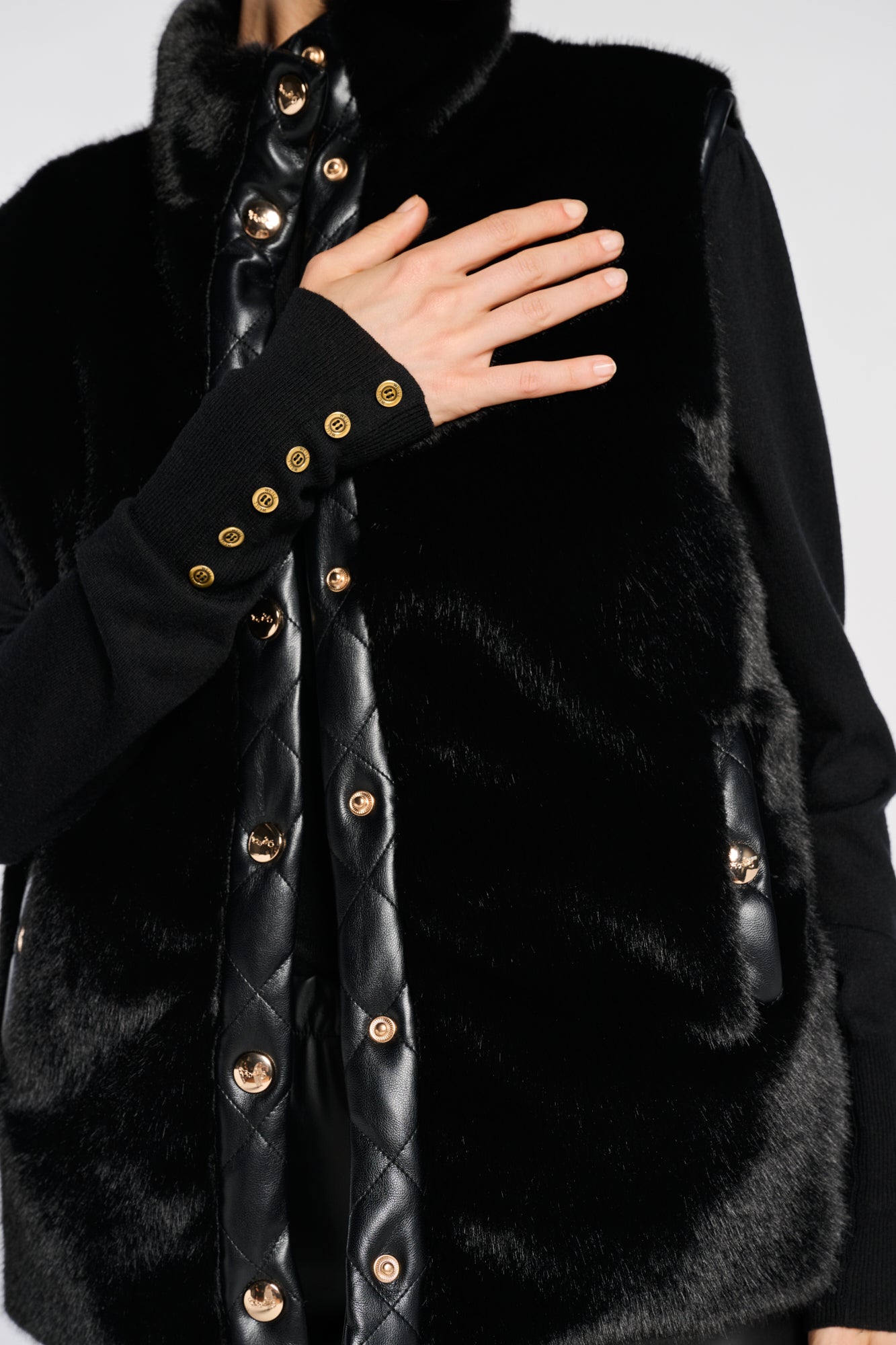 Sleeveless dual-material jacket