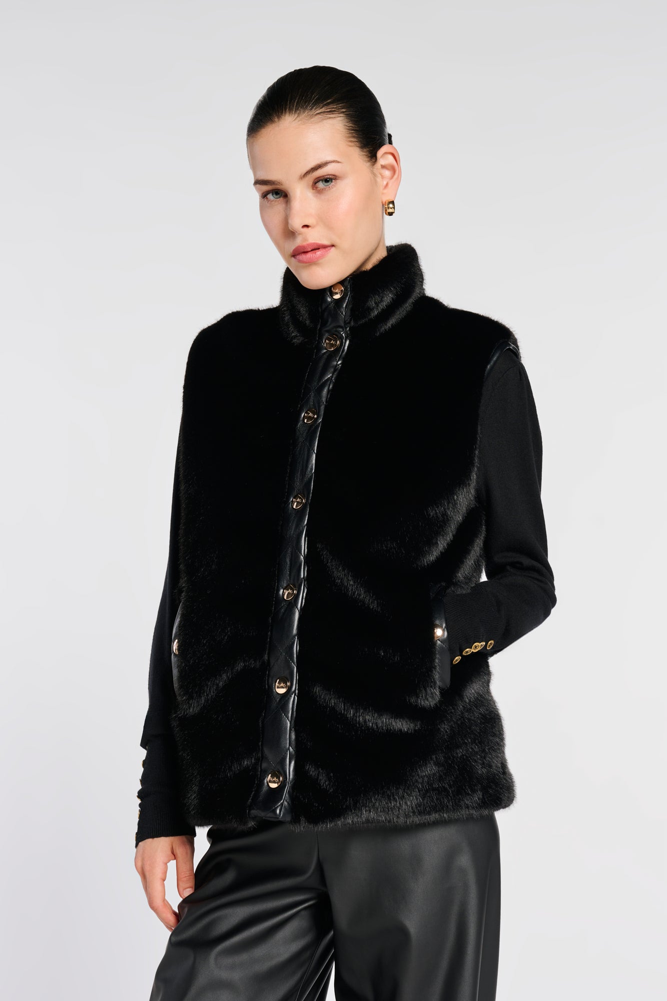 Sleeveless dual-material jacket