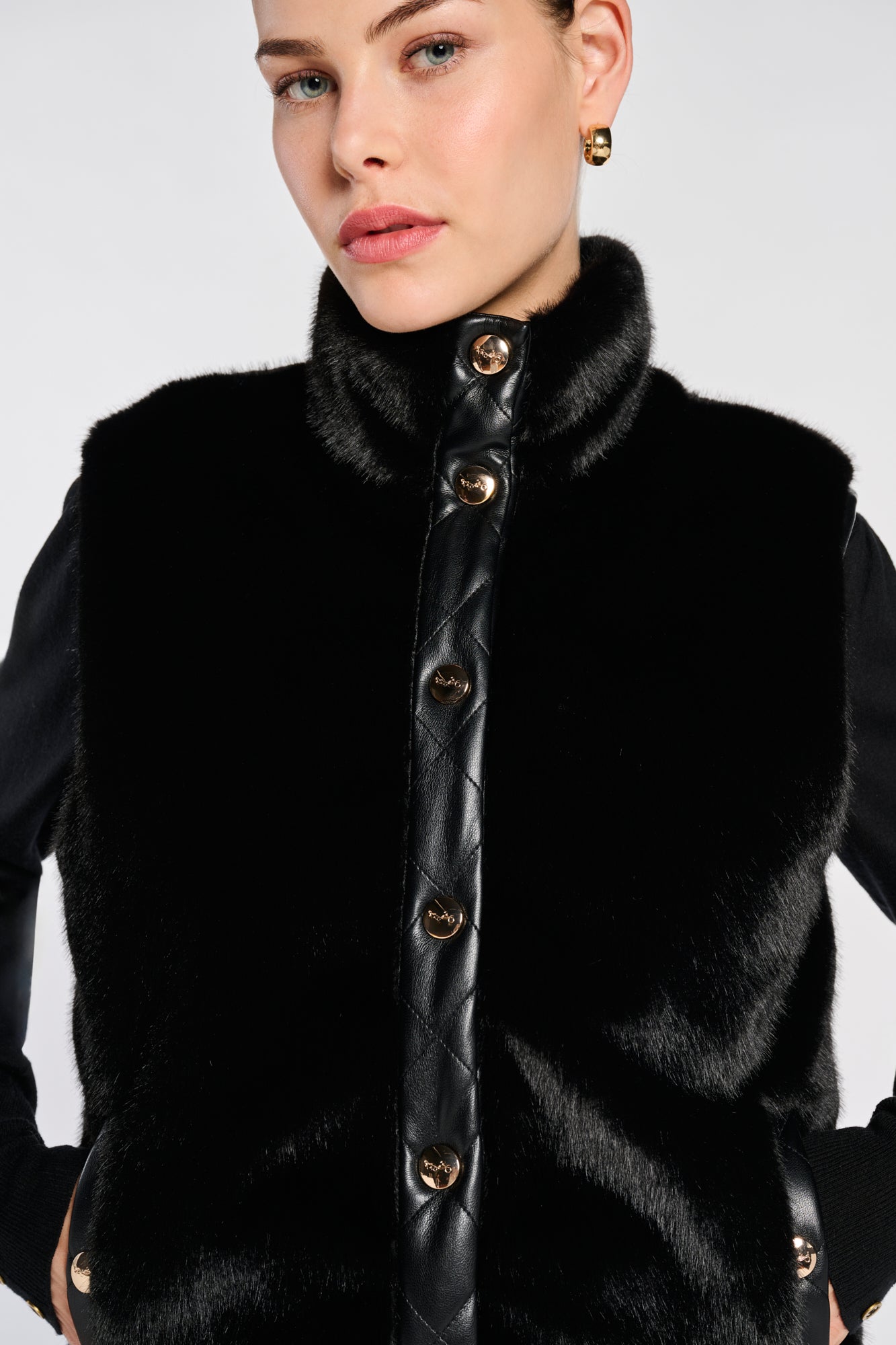 Sleeveless dual-material jacket
