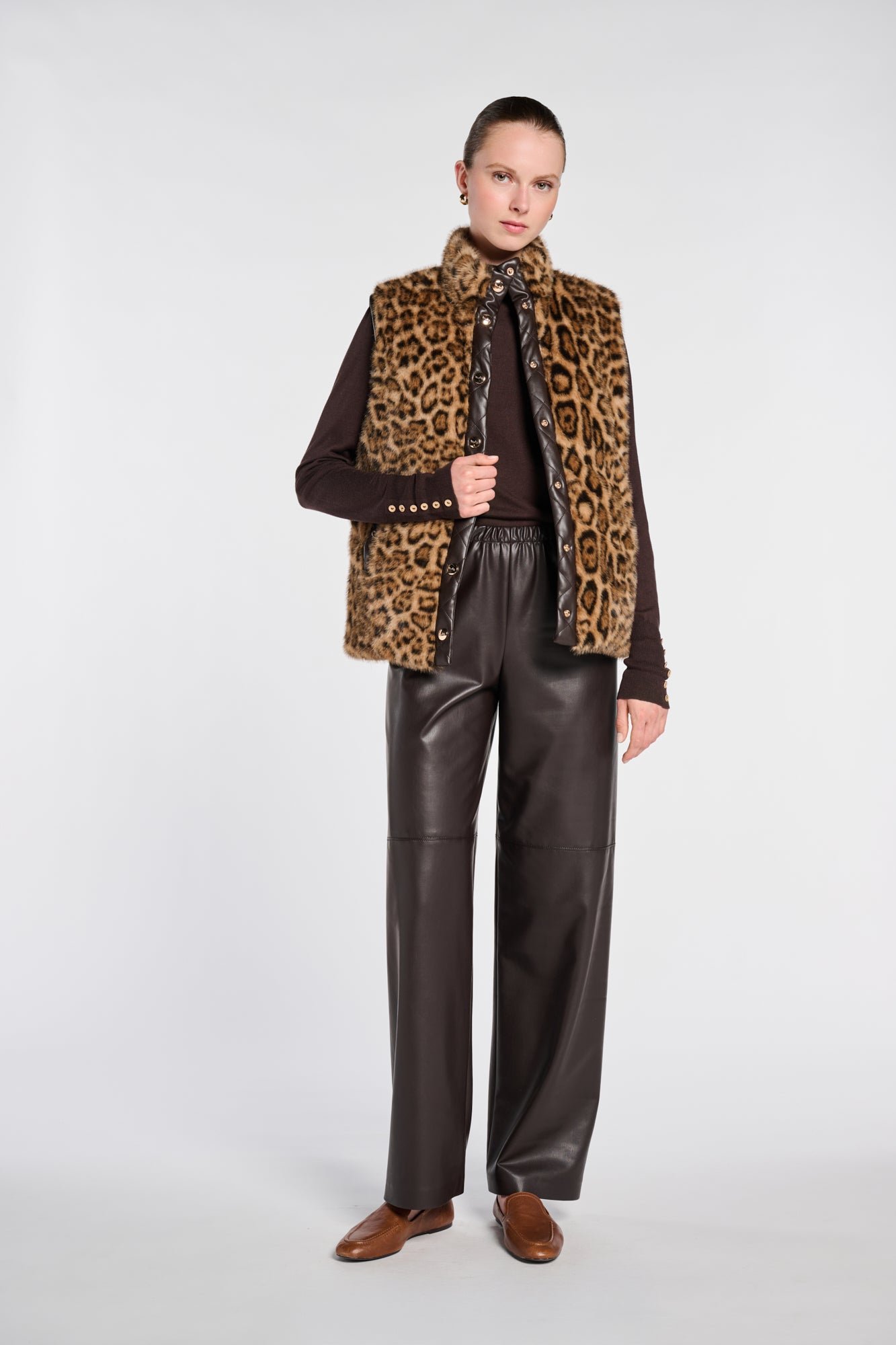 Sleeveless dual-material jacket