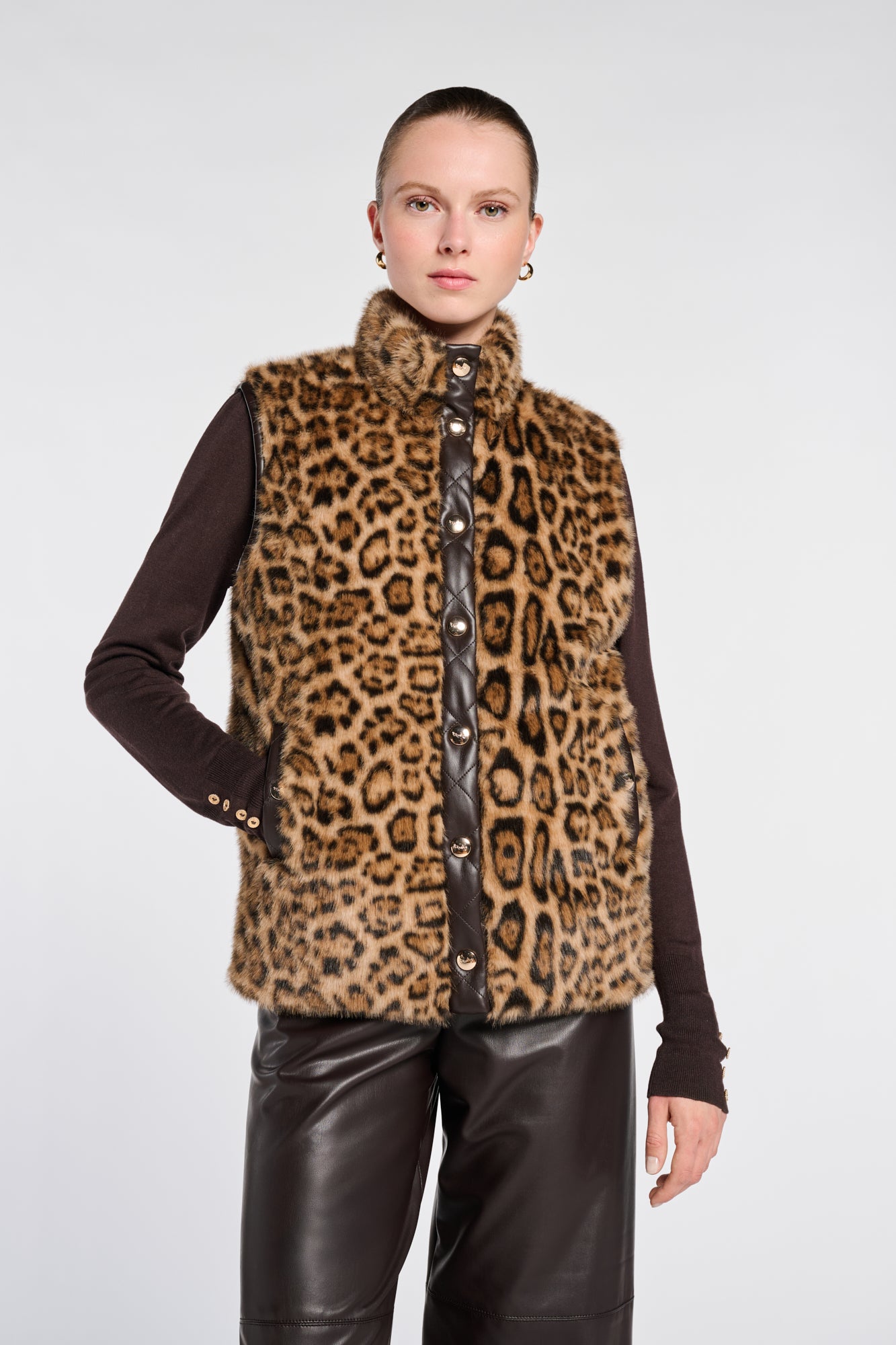 Sleeveless dual-material jacket