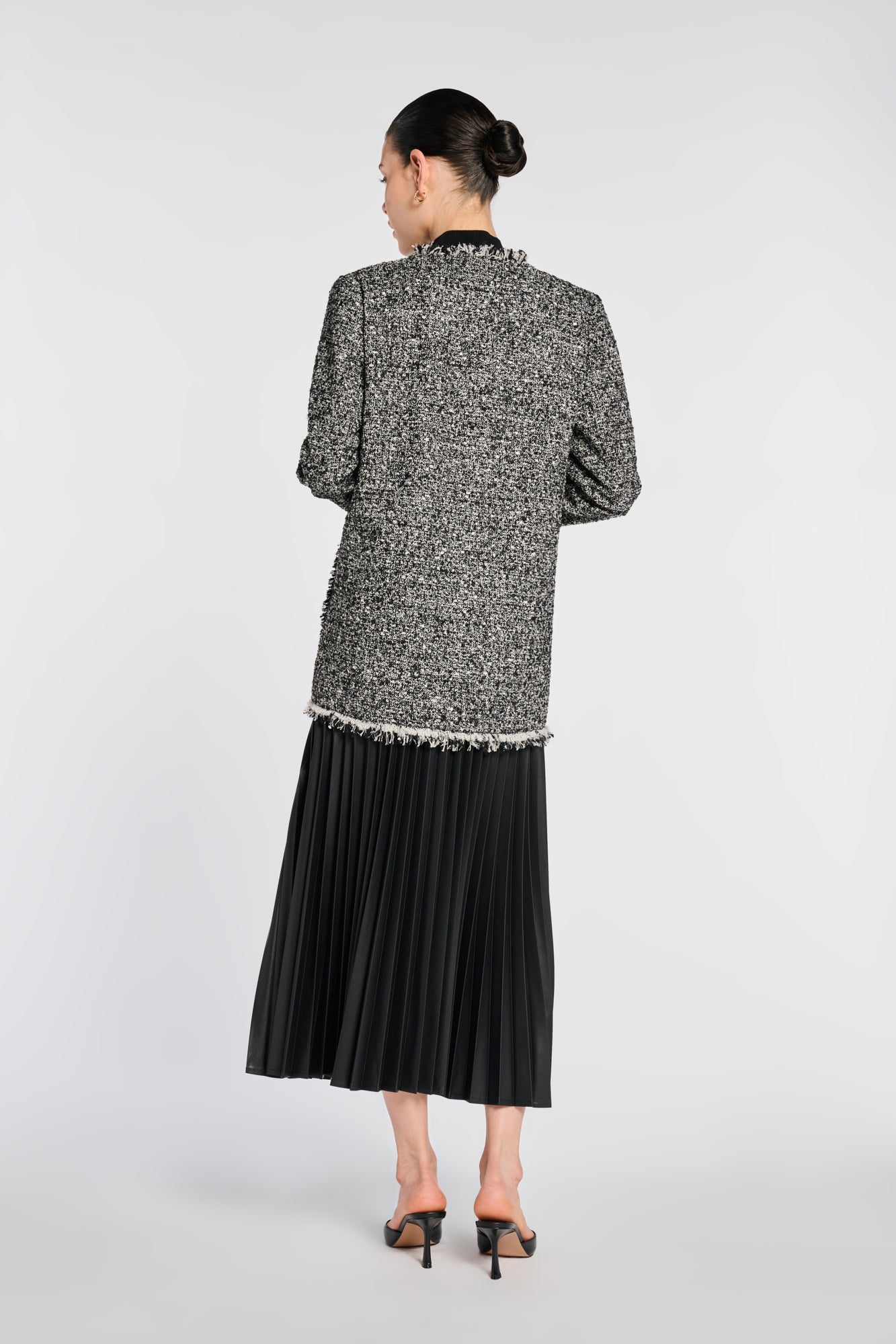 Veste longue en tweed frangée