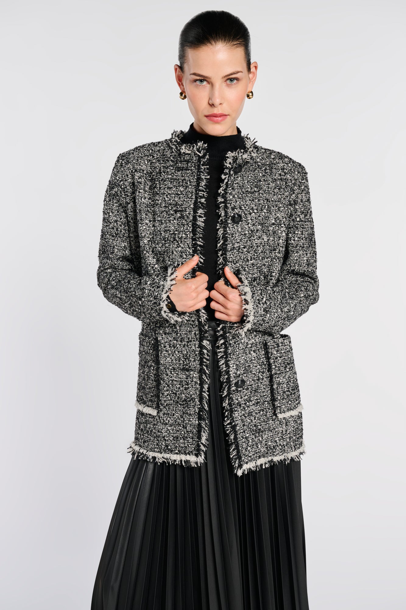Veste longue en tweed frangée