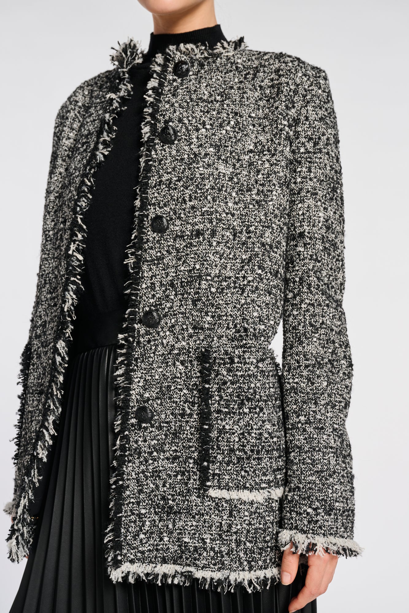 Veste longue en tweed frangée