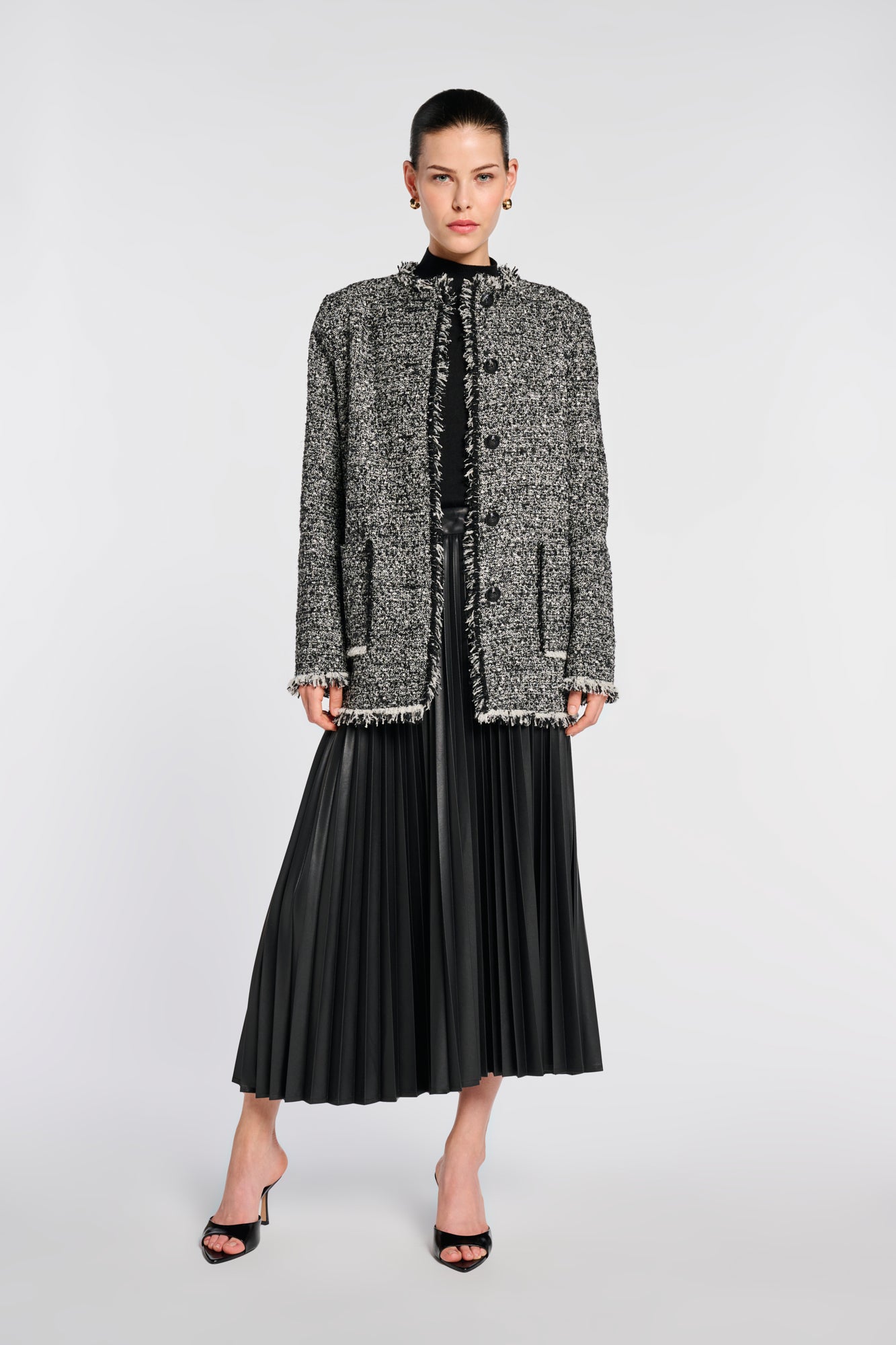 Veste longue en tweed frangée