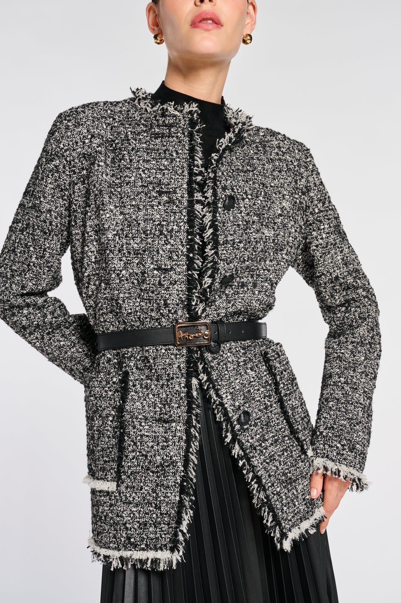 Veste longue en tweed frangée