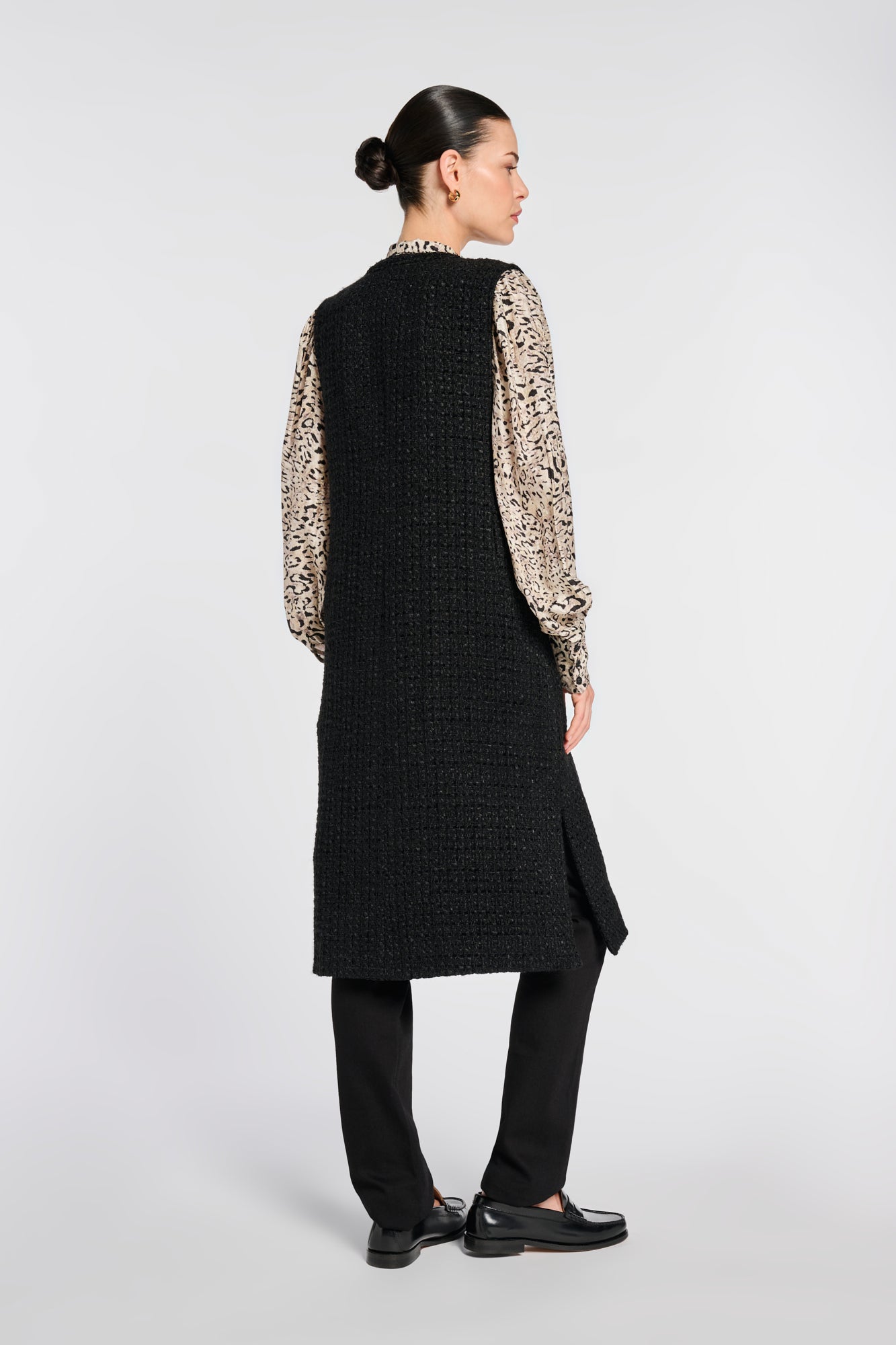 Long sleeveless tweed jacket