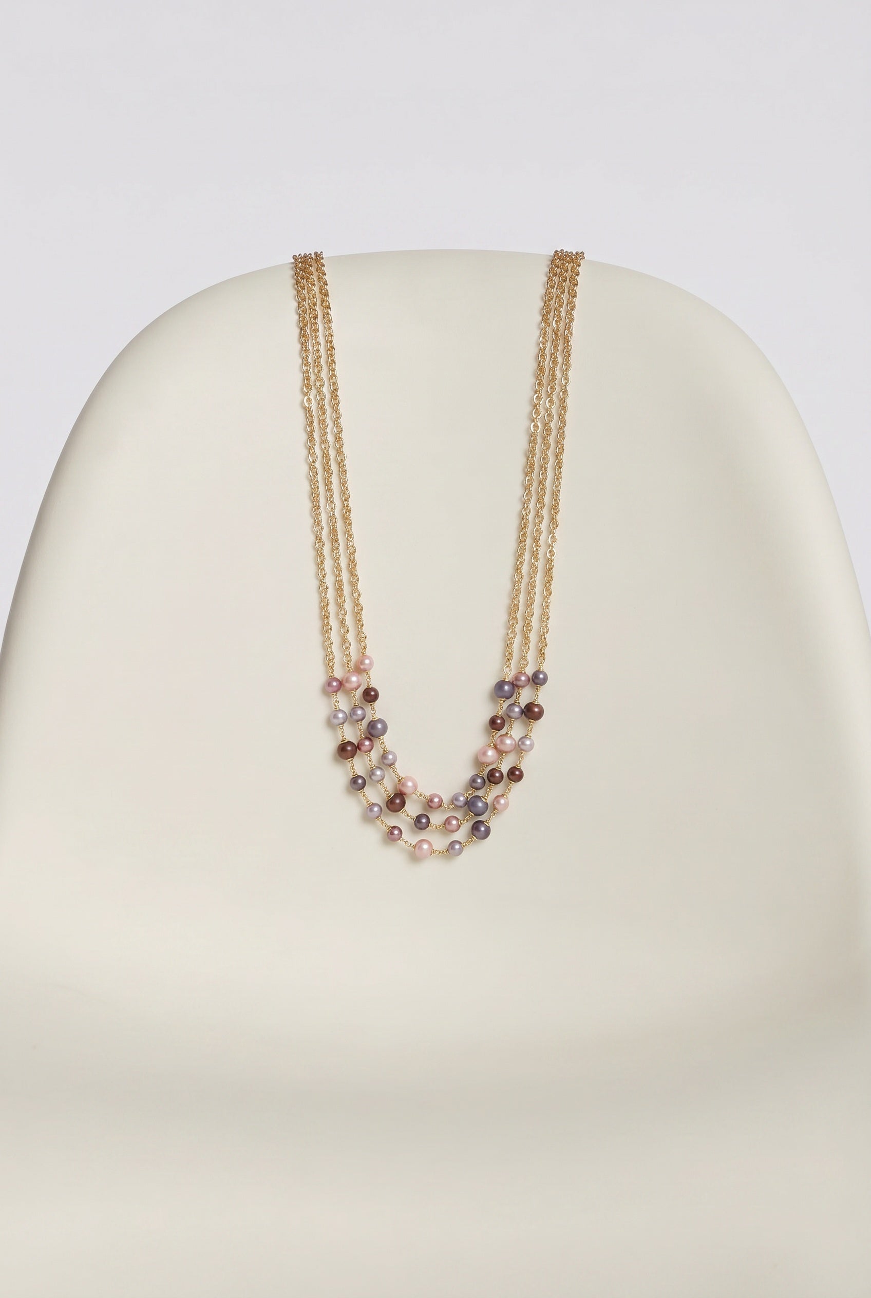 Triple-strand necklace with chain and beads