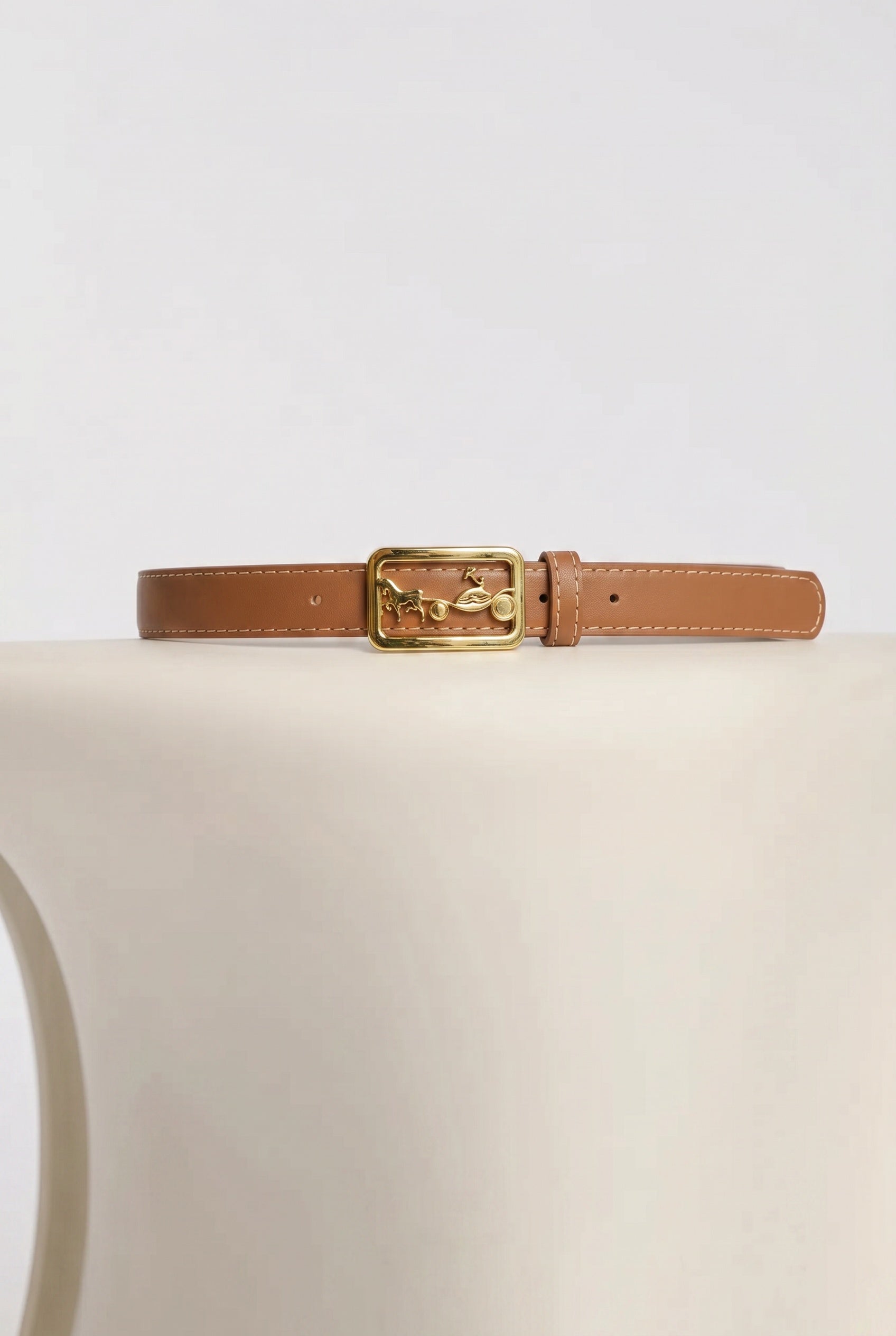 Leather belt with a carriage-style buckle