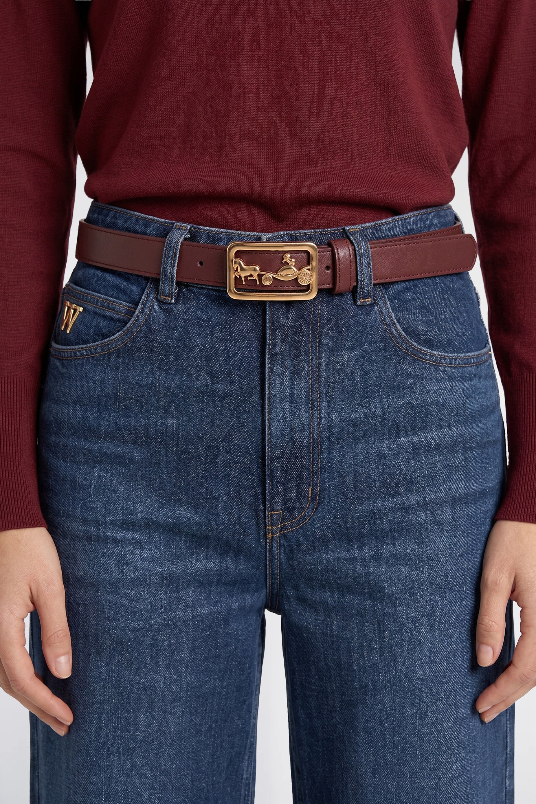 Leather belt with a carriage-style buckle